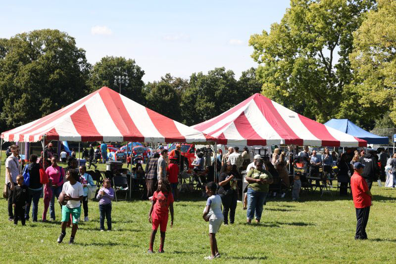 Group of people at an outdoor community barbeque event