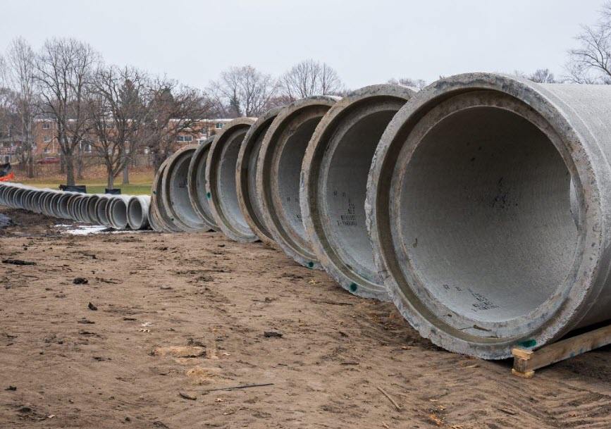 Photo of the opening of a sewer pipe underground