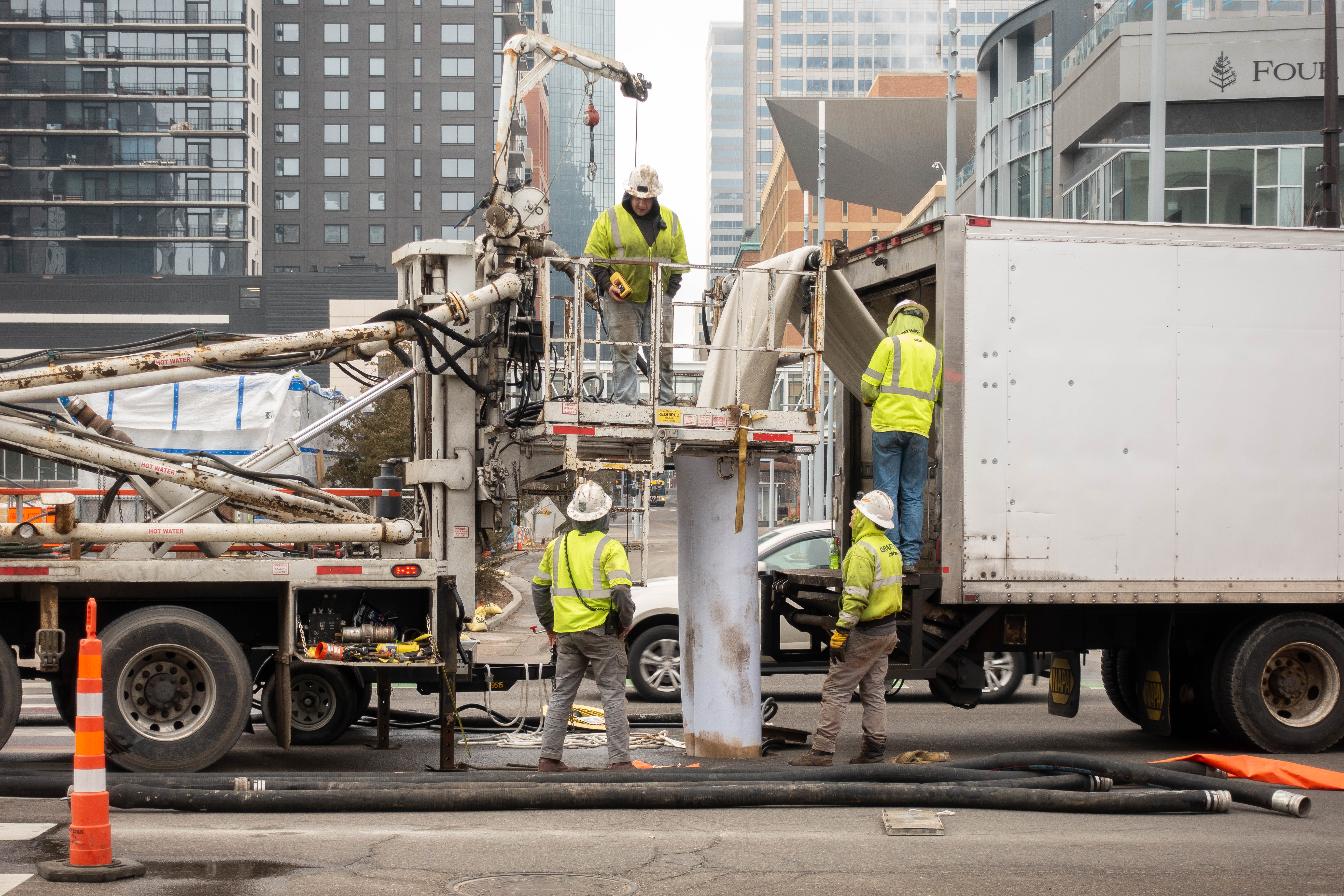 Public Works crews work to line pipe to repair existing sewer pipes