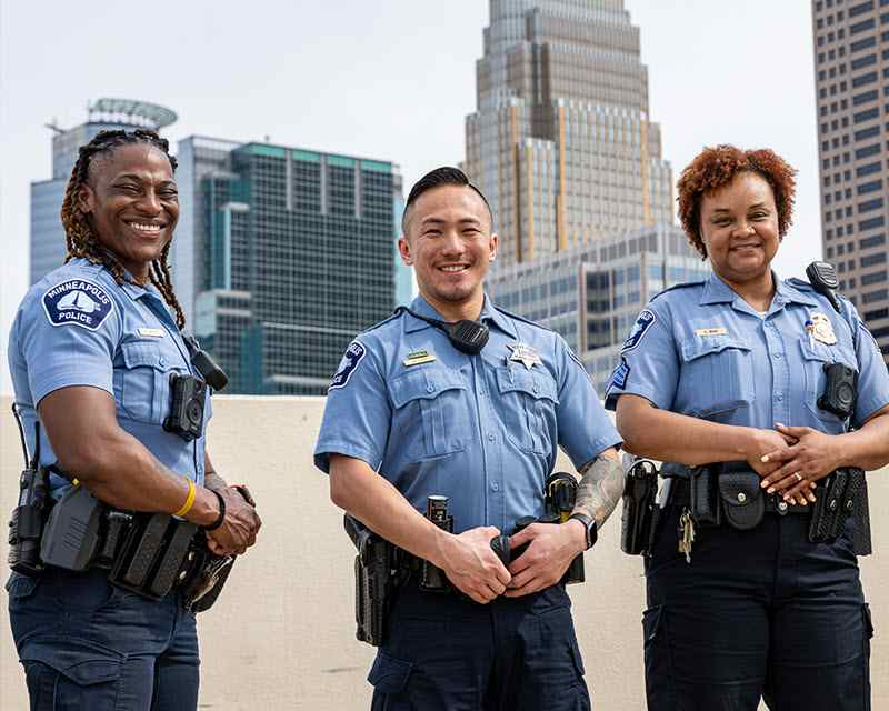Three police officer looking at camera