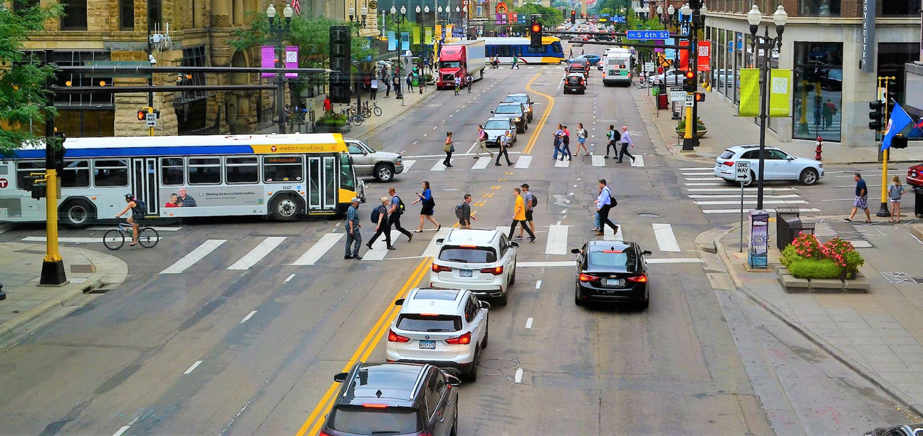 Downtown cars bus pedestrians