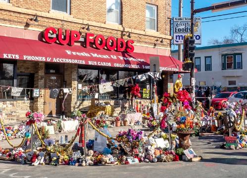 flowers in front of Cup Foods