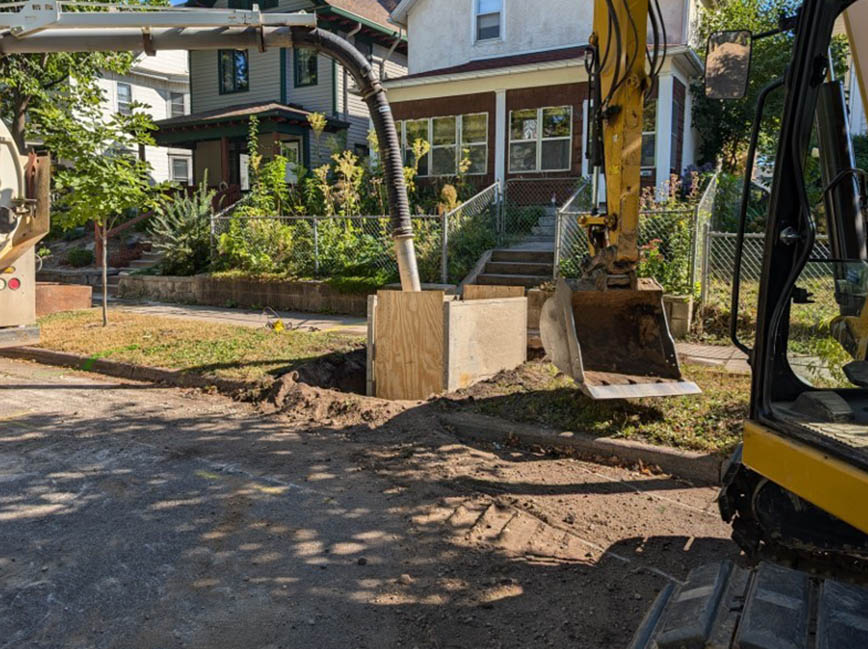 Workers replacing water service lines.