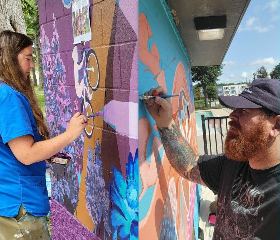 Artists creating murals. Photo credit Constanza Caraballo and Marco Aguero