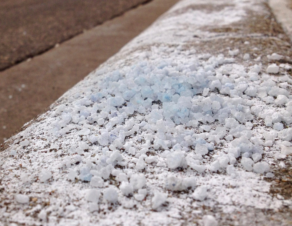 Pile of rock salt on sidewalk