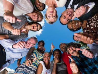 Group of people in circle smiling