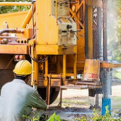 Person drilling a well