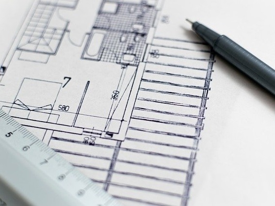 pencil and ruler on top of paper
