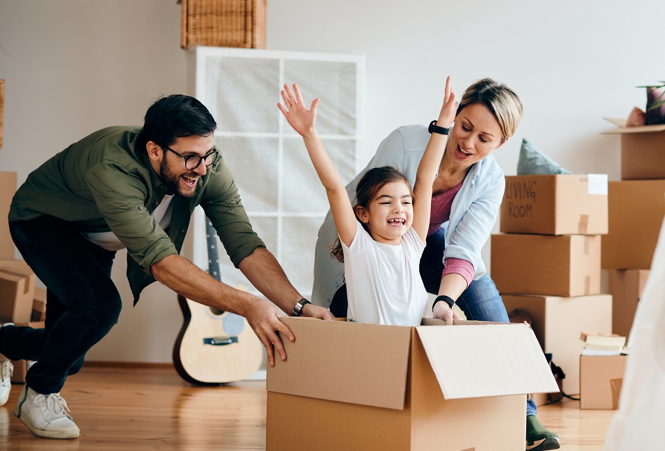 Family laughing in new home