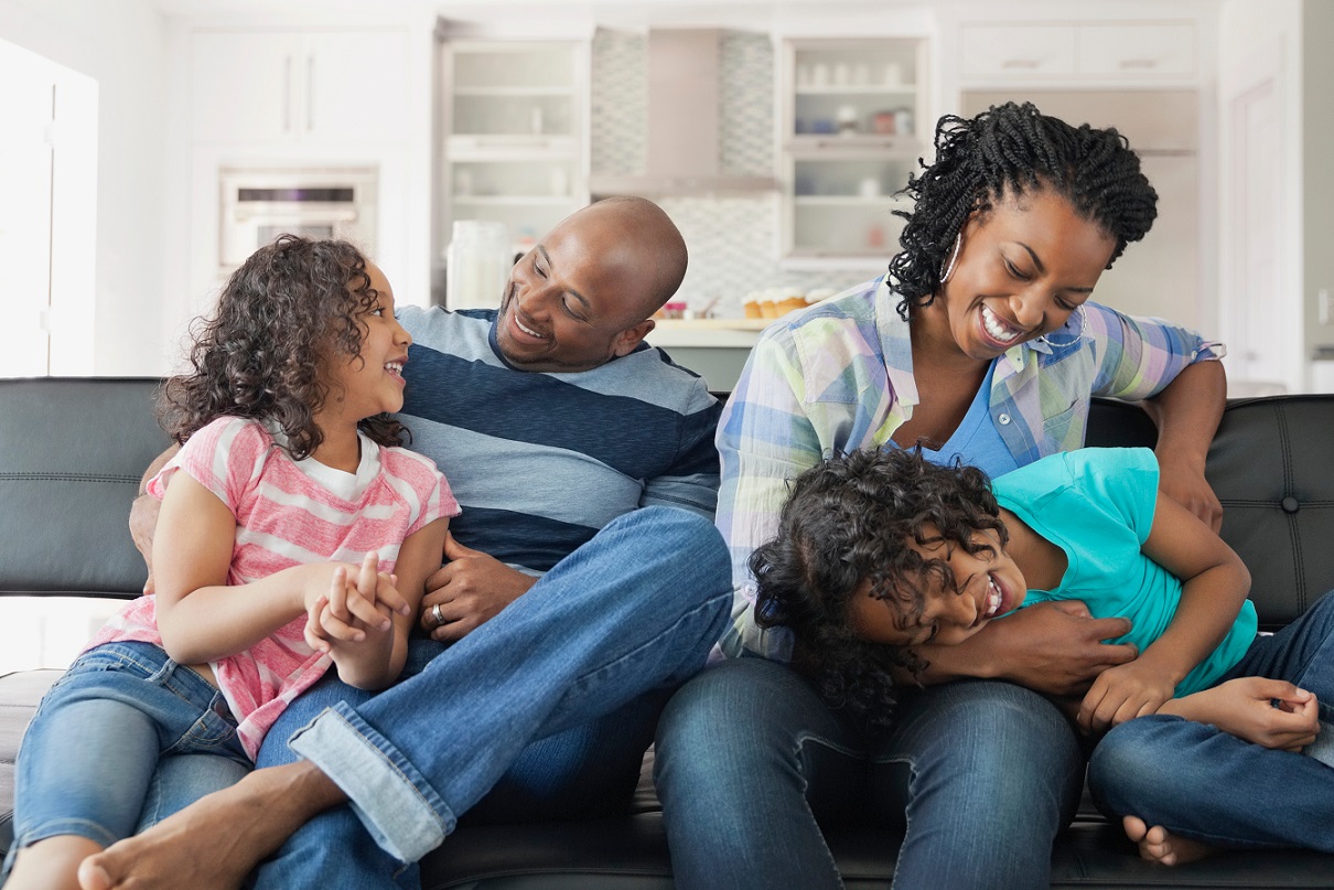 Family laughing in new home