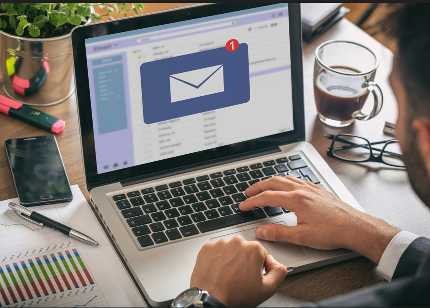 Person checking their email on laptop.