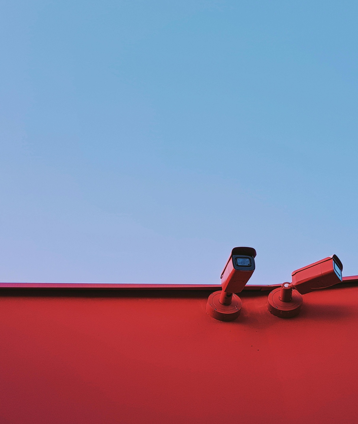Two Security Cameras Mounted on the Wa