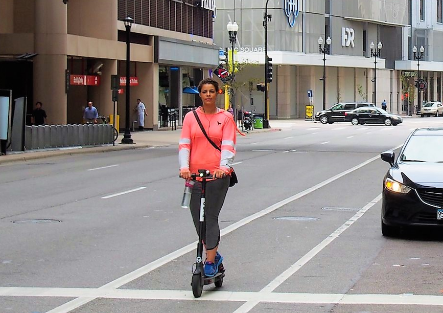 Person on scooter downtown mpls