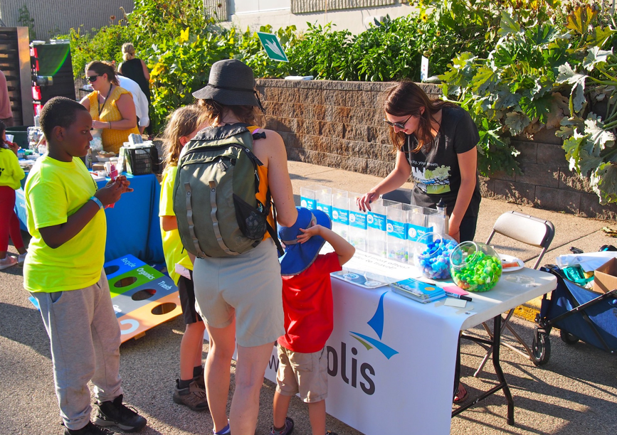 People at a Public Works engagement stand