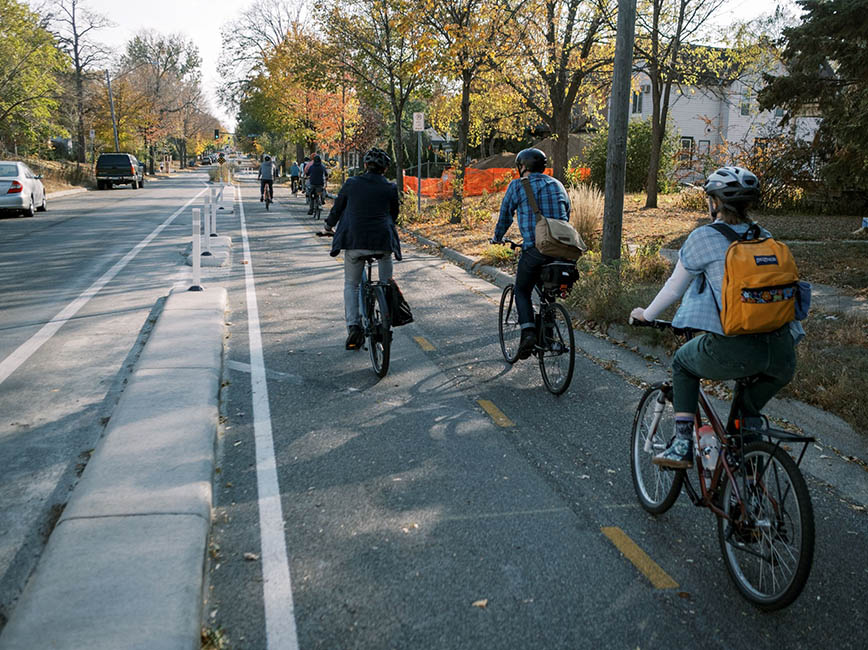 A group of people riding bikes.