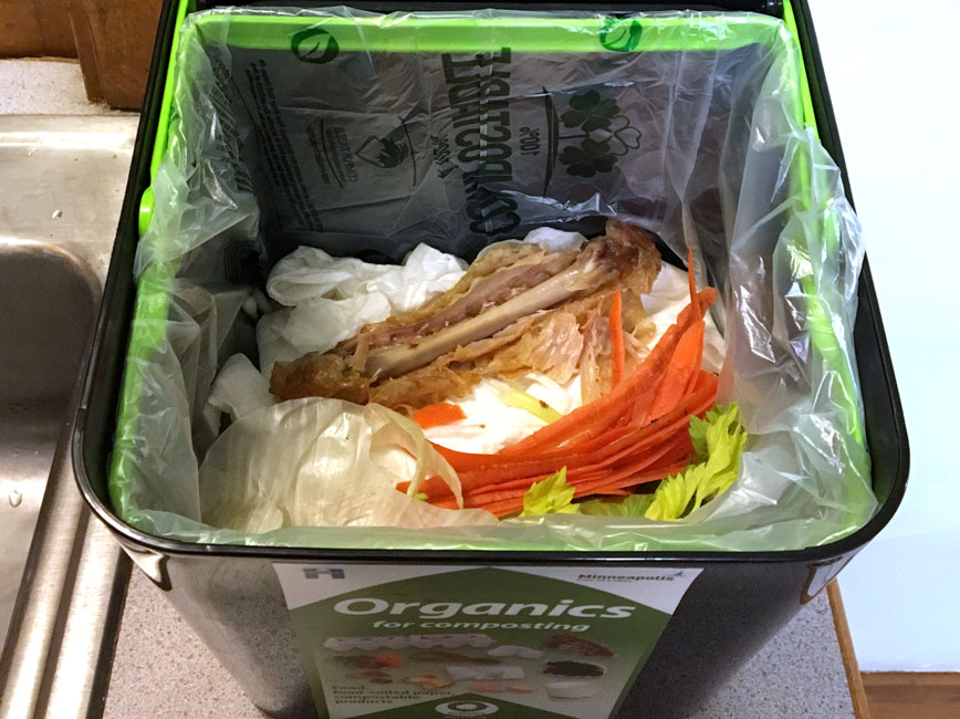 organic recycling container showing dry organic materials