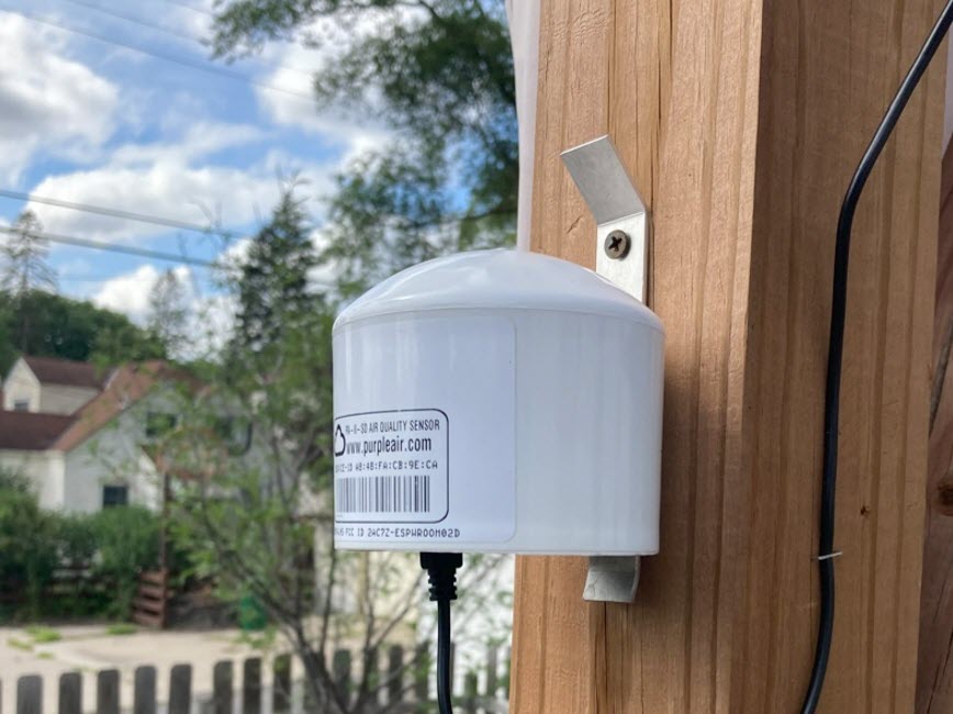 Air sensor attached to post in residential neighborhood