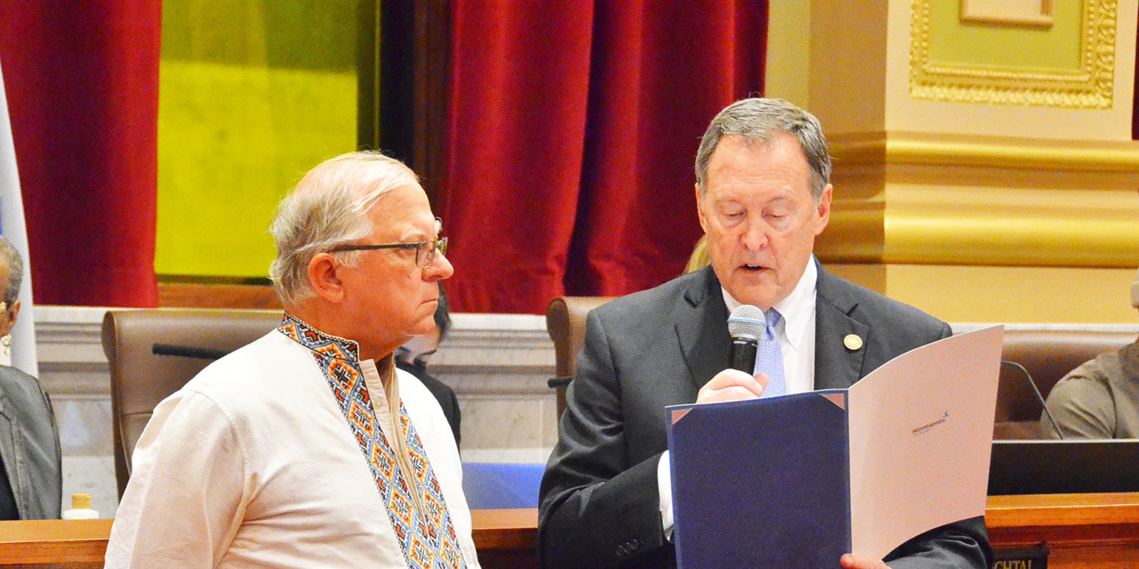 Council Member Rainville presents Unity with Ukraine resolution to Orest Kramarczuk. Council Member Rainville presents Unity with Ukraine resolution to Orest Kramarczuk.
