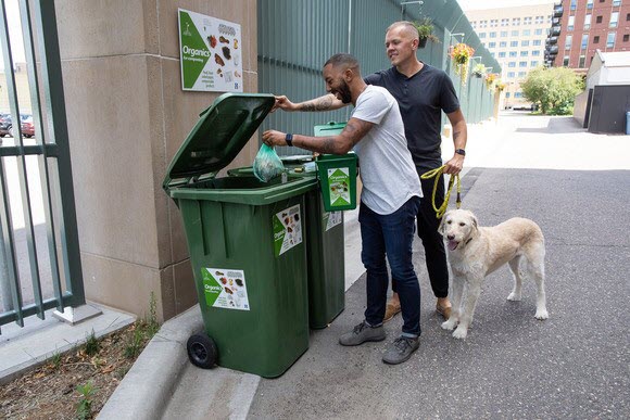 tenants bringing organics to cart at their apartment building