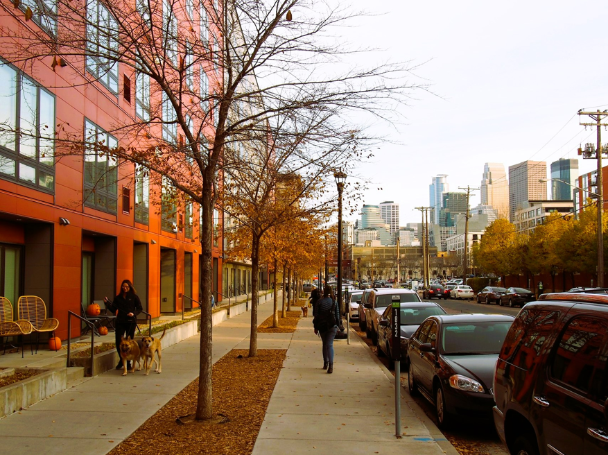 Cars parked and people walking