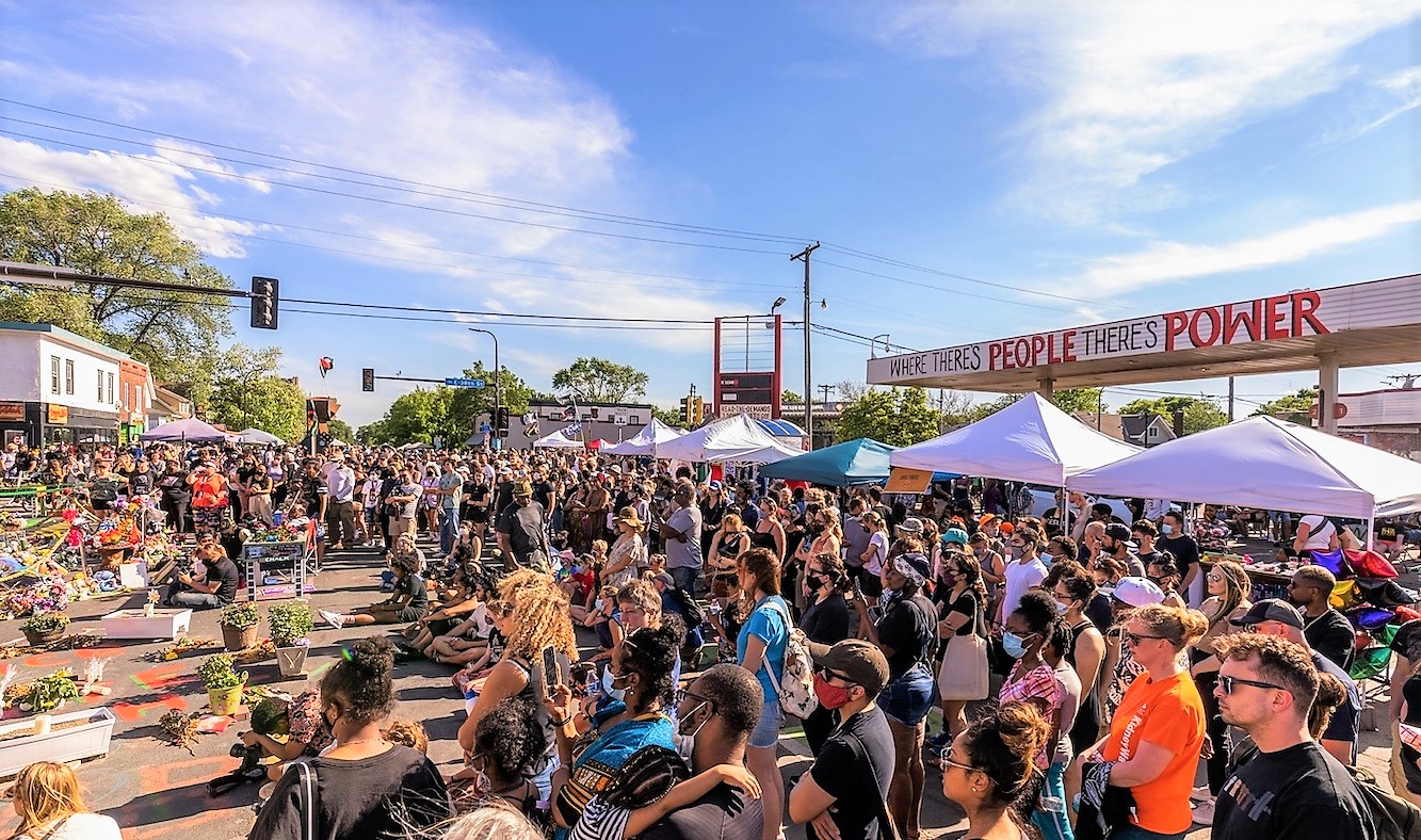 Chad Davis photo of crowd at George Floyd Square on sunny day May 2021