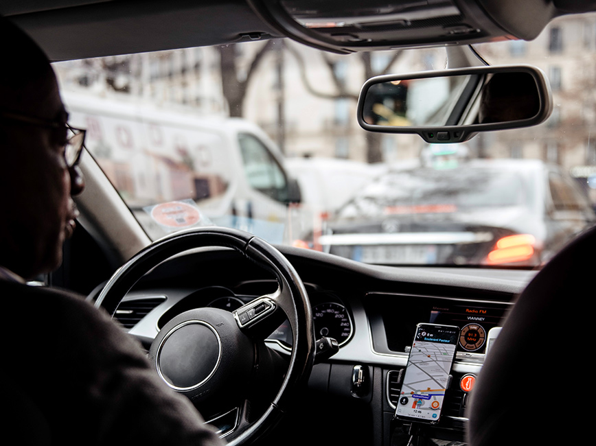 A man driving for a transportation network company (TNC) A man driving for a transportation network company (TNC)