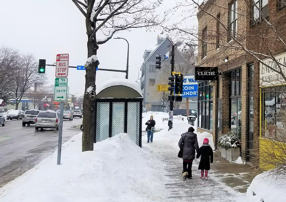 People walking and cars driving in winter