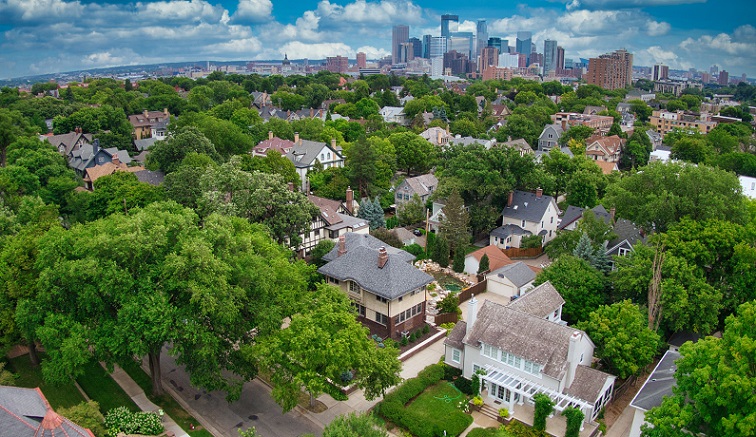 Minneapolis neighborhood with skyline in background Minneapolis neighborhood with skyline in background