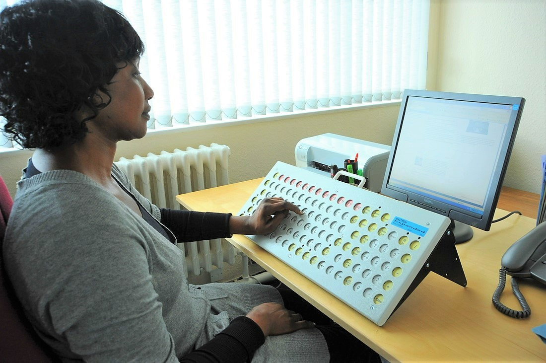 Person using keyboard for disabilities