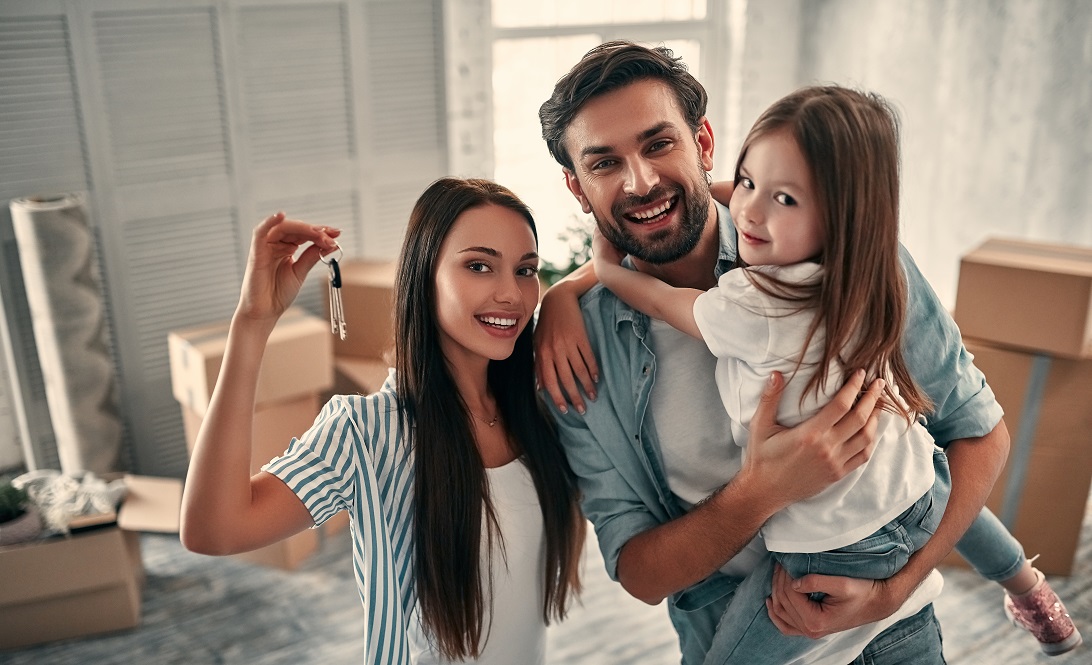 family with keys to house