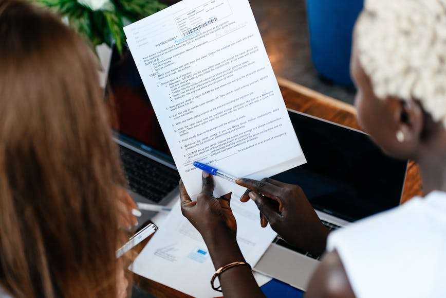 Person pointing at a document