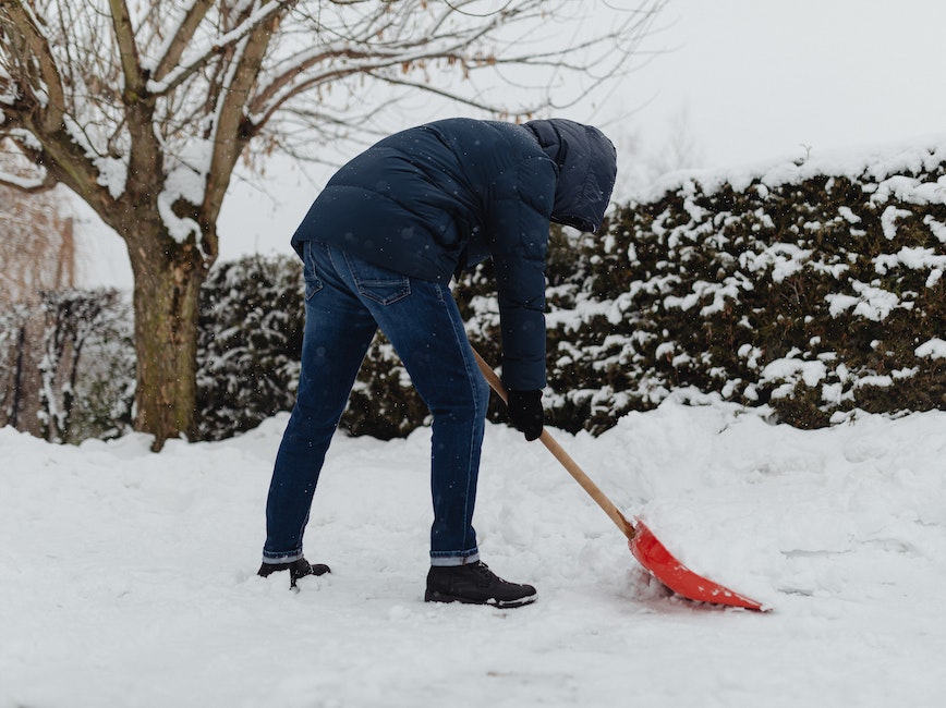 Person shovels snow