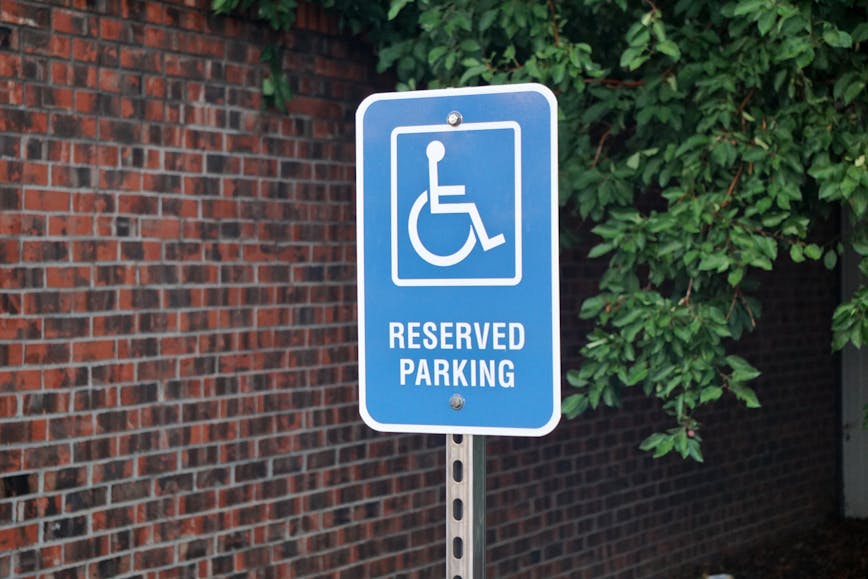 Blue accessible parking sign