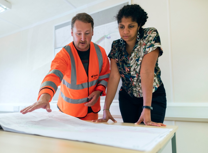 People reviewing blueprints