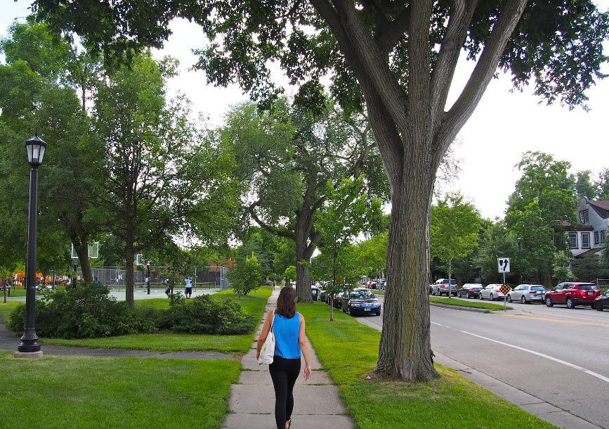 Person walking down sidewalk